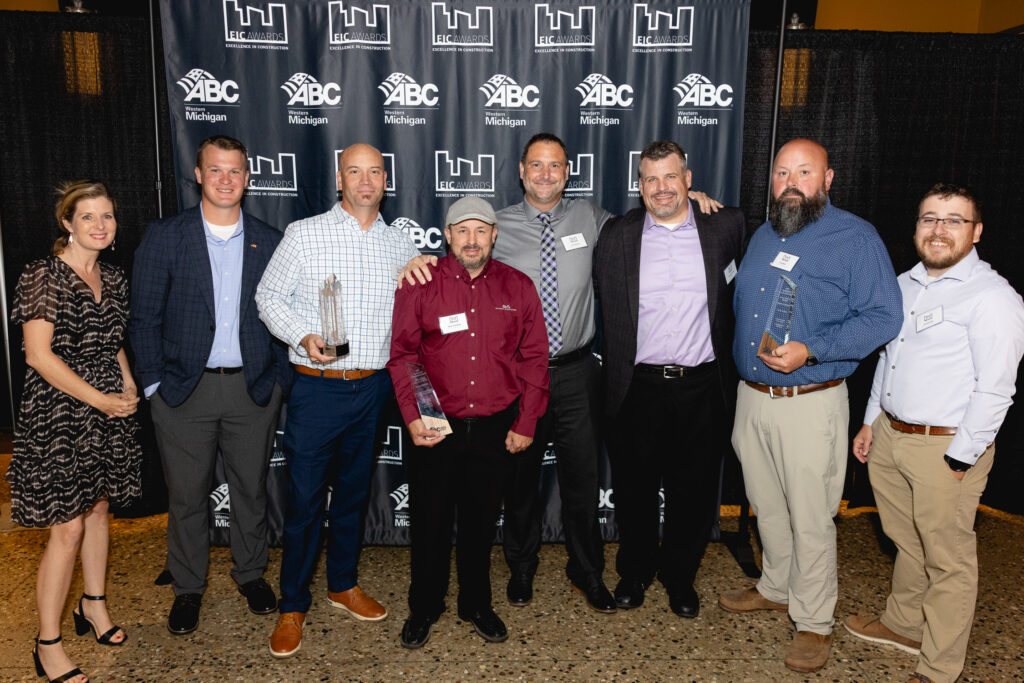 Several ABC West Michigan award winners posing with their awards in a group