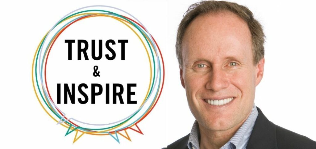 Stephen Covey smiling next to a circle made out of chat bubbles that states "Trust & Inspire"